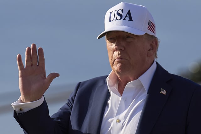 President Donald Trump waves to the media after exiting Air Force One, at Joint Base Andrews, Md., Sunday, July 6, 2025, en route to the White House after spending the weekend in New Jersey. (AP Photo/Jacquelyn Martin)