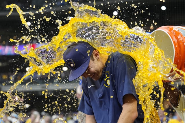 MILWAUKEE, WISCONSIN - JULY 08: Caleb Durbin #21 and Andruw Monasterio #14 of the Milwaukee Brewers dump Gatorade on Jacob Misiorowski #32 after the Brewers defeated the Los Angeles Dodgers 3-1 at American Family Field on July 08, 2025 in Milwaukee, Wisconsin.