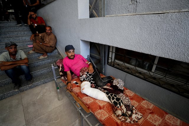 A wounded Palestinian lies on a bed at Al-Shifa Hospital, which Gaza's health ministry says is at risk of shutting down due to the Israeli blockade of fuel, in Gaza City July 9, 2025. REUTERS/Mahmoud Issa         TPX IMAGES OF THE DAY