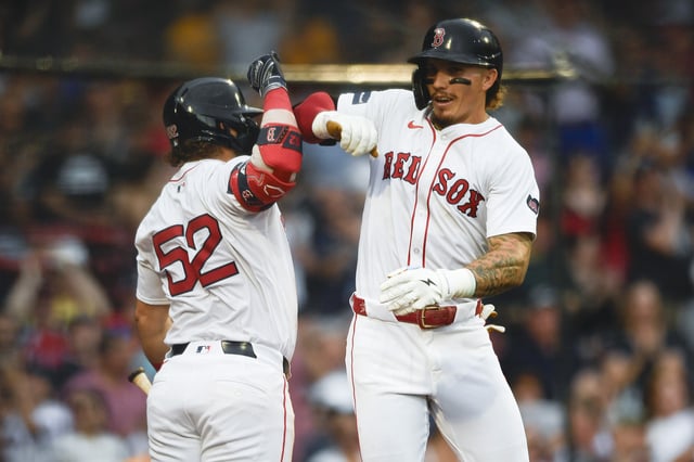 BOSTON, MASSACHUSETTS - JUNE 30: Wilyer Abreu #52 of the Boston Red Sox, left, and Jarren Duran #16 of the Boston Red Sox celebrate after Duran hit a one-run home run during the fifth inning of a game against the San Diego Padres at Fenway Park on June 30, 2024 in Boston, Massachusetts.