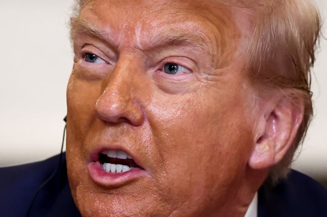 U.S. President Donald Trump reacts, as he hosts a lunch for African leaders of Gabon, Guinea-Bissau, Liberia, Mauritania, and Senegal in the State Dining Room at the White House in Washington, D.C., U.S., July 9, 2025. REUTERS/Kevin Lamarque