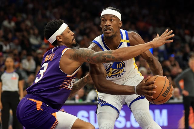 Golden State Warriors forward Jimmy Butler III (10) drives to the basket against Phoenix Suns guard Bradley Beal (3) during the first half at PHX Arena on April 8, 2025.