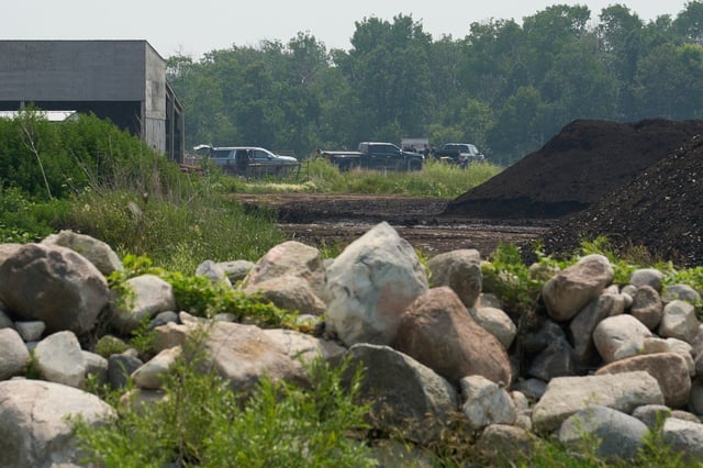 Investigators at the scene of a crash involving two aircraft in Steinbach, Man., Tuesday July 8, 2025. 