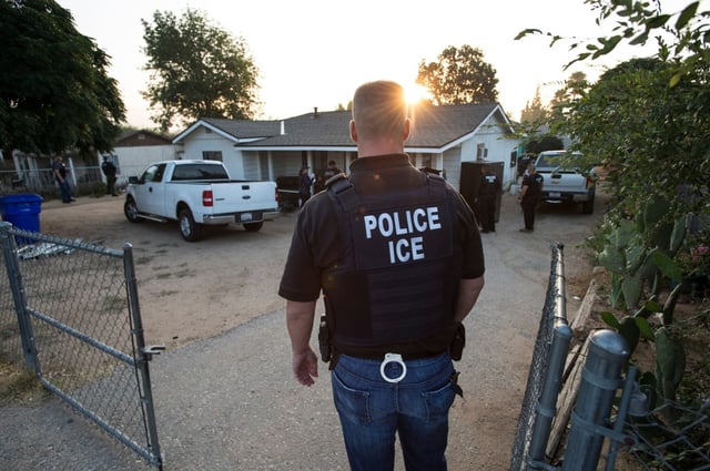Thomas Giles, Deputy Field Office Director, keeps watch as ICE Fugitive Enforcement Operations Team move towards a resident seeking a criminal alien fugitive in Riverside County on Thursday, June 22, 2017. (File photo by Ed Crisostomo, Los Angeles Daily News/SCNG)