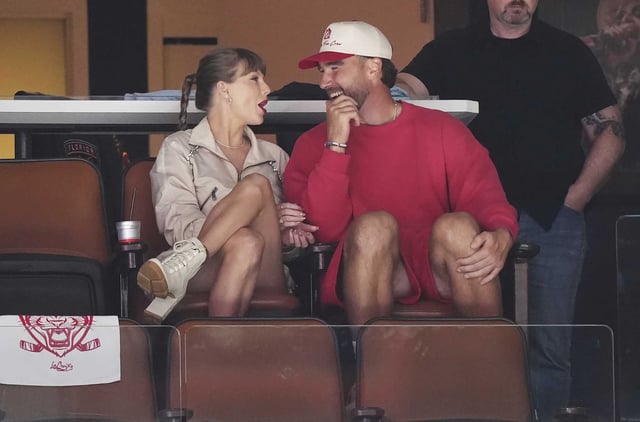 Singer Taylor Swift, left, and Kansas City Chiefs football player Travis Kelce, front right, take in the third period in Game 4 of the NHL hockey Stanley Cup Final between the Edmonton Oilers and the Florida Panthers in Sunrise, Fla., on June 12, 2025. 