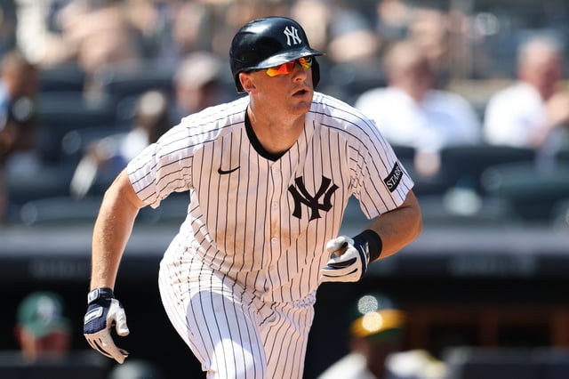 Jun 28, 2025; Bronx, New York, USA; New York Yankees second base DJ LeMahieu (26) singles during the eighth inning against the Athletics at Yankee Stadium. Mandatory Credit: Vincent Carchietta-Imagn Images/File Photo