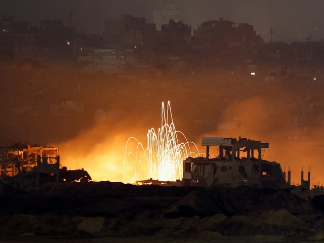 Streaks of light are seen amid smoke and flames resulting from an explosion in Gaza, as seen from the Israeli side of the Israel-Gaza border, July 9, 2025. REUTERS/Amir Cohen