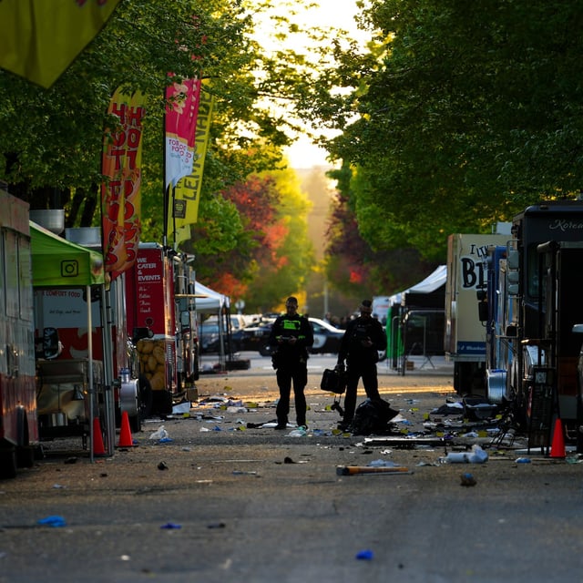 Members of the Vancouver Police forensics team examine the scene where a vehicle drove into a crowd at a Lapu Lapu Day street festival Saturday evening in Vancouver, B.C., Sunday, April 27, 2025. THE CANADIAN PRESS/Sean Kilpatrick