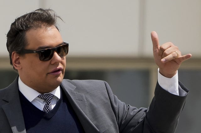 Former U.S. Rep. George Santos leaves federal court after being sentenced to more than seven years in prison for fraud and identity theft, Friday, April 25, 2025, in Central Islip, N.Y. (AP Photo/Julia Demaree Nikhinson)