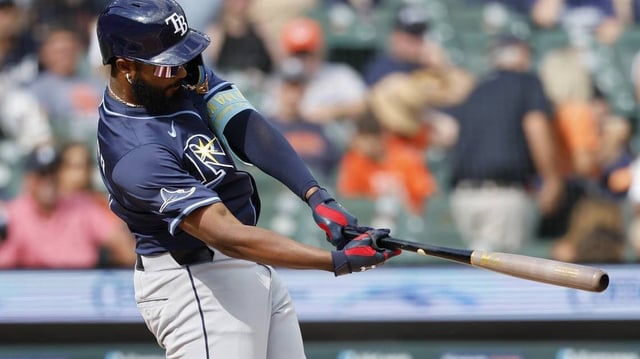 Jul 9, 2025; Detroit, Michigan, USA;  Tampa Bay Rays third baseman Junior Caminero (13) hits a single in the first inning against the Detroit Tigers at Comerica Park. Mandatory Credit: Rick Osentoski-Imagn Images