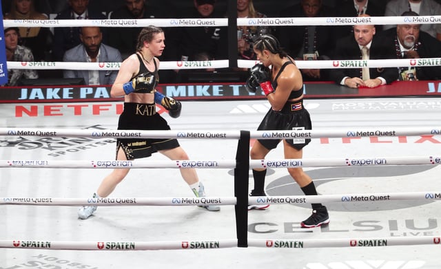 Nov 15, 2024; Arlington, Texas, UNITED STATES;  Amanda Serrano (red gloves) fights Katie Taylor(blue gloves)  at AT&T Stadium. Mandatory Credit: Kevin Jairaj-Imagn Images/File Photo