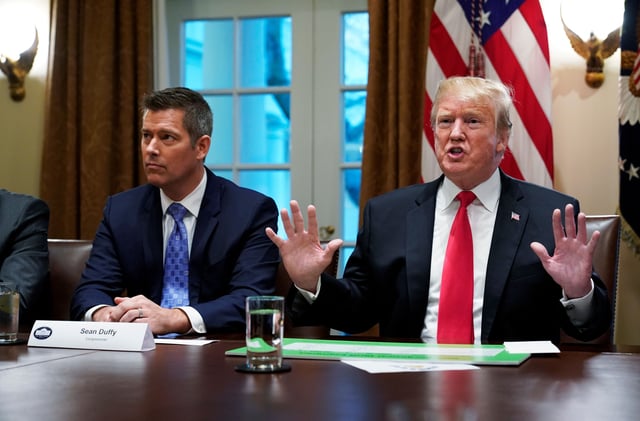 US President Donald Trump, with then US Congressman Sean Duffy (L), can be seen speaking in the Cabinet Room of the White House on January 24, 2019. (Photo by MANDEL NGAN / AFP) (Photo credit should read MANDEL NGAN/AFP via Getty Images)