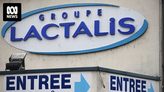 a exterior image of a Lactalis factory with the company's logo on the wall and a sign pointing to the entrance