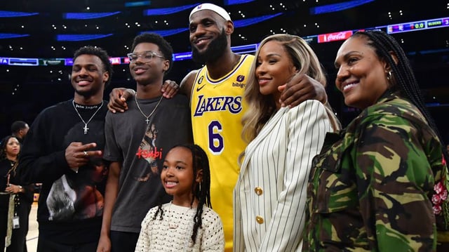 Los Angeles Lakers forward LeBron James (6) poses for photos with his sons Bronny and Bryce Maximus, daughter Zhuri, wife Savannah and mother Gloria after the game against the Oklahoma City Thunder at Crypto.com Arena. Mandatory Credit: Gary A. Vasquez-Imagn Images