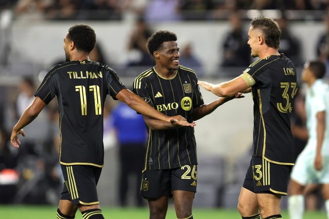 LAFC forward Javairo Dilrosun, center, celebrates with teammates Timothy Tillman, left, and Aaron Long after Dilrosun scored his first goal with the team during the second half of an MLS match against the Colorado Rapids on Wednesday night at BMO Stadium. LAFC won, 3-0. (Photo by Raul Romero Jr., Contributing Photographer)