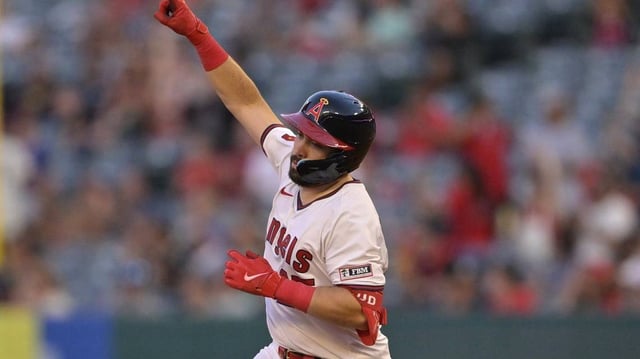 Angels catcher Travis d’Arnaud celebrates as he rounds the bases after hitting a solo home run during an 11-8 victory over the Rangers on Wednesday.