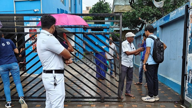 Police personnel seen as South Calcutta Law College classes resume amid an ongoing investigation into an alleged gang rape incident, in Kolkata.