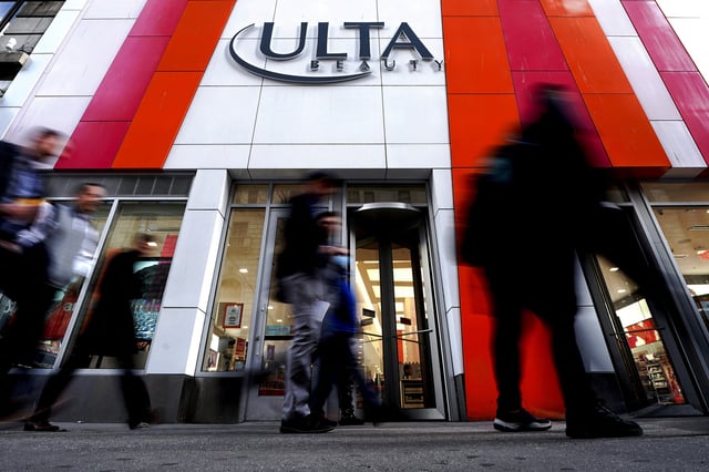 People walk past an Ulta Beauty store in the Manhattan borough of New York City, New York, U.S., March 8, 2022.  REUTERS/Carlo Allegri/File Photo