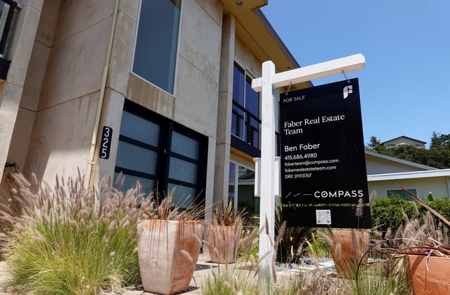 A Compass Realty sign is posted in front of a home for sale on June 23, 2025, in Greenbrae, California.