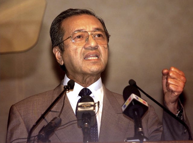 FILE - Malaysian Prime Minister Mahathir Mohamad speaks during the International Symposium on Currency Controls and Asian Monetary Cooperation in Kuala Lumpur, Sept. 2, 1999. (AP Photo/Vincent Thian)