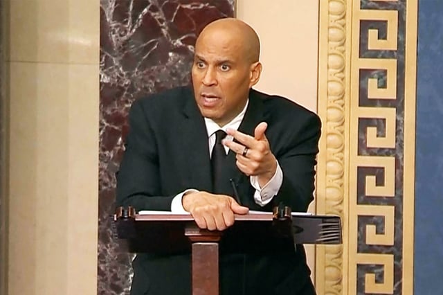 Sen. Cory Booker speaks through the night on Senate floor, criticizing Trump and Musk on April 1, 2025.