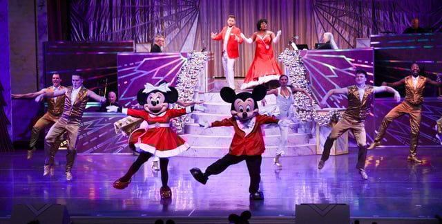 Mickey and Minnie perform during last year&#39;s debut of Disney Jollywood Nights at Hollywood Studios theme park. (Joe Burbank/Orlando Sentinel)