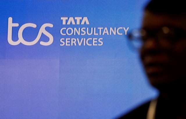 A man walks past a logo of Tata Consultancy Services (TCS) in Mumbai, India, January 11, 2024. REUTERS/Francis Mascarenhas/File Photo
