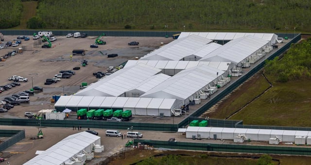 Aerial view of structures, including gigantic tents built at the recently opened migrant detention center,“ Alligator Alcatraz,” located at the site of the Dade-Collier Training and Transition Airport in Ochopee, Florida, on Friday, July 4, 2025. (Pedro Portal/Miami Herald/TNS)