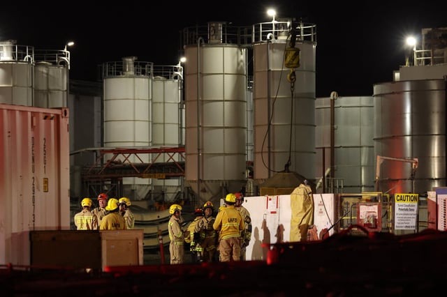 Los Angeles Fire Department (LAFD) firefighters are seen at the site of an industrial tunnel collapse in the Wilmington neighborhood of Los Angeles on July 9, 2025. 31 workers were safely removed from the tunnel without visible injuries, the LAFD said on July 9.