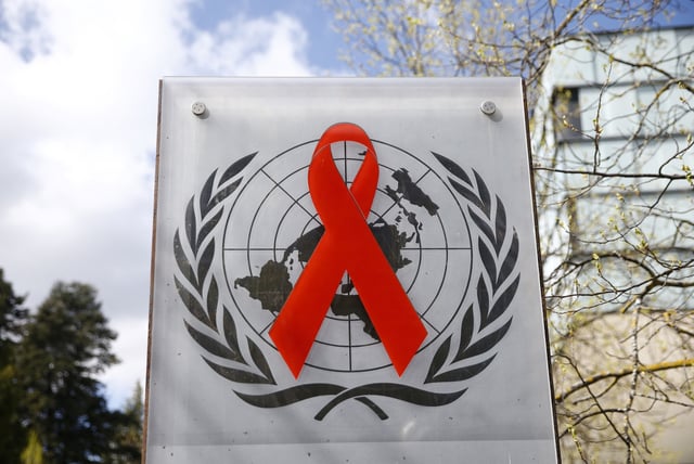 A logo is pictured outside a building of the United Nations AIDS agency (UNAIDS) in Geneva, Switzerland, April 6, 2021. Picture taken April 6, 2021. REUTERS/Denis Balibouse/File Photo