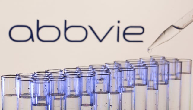 Test tubes are seen in front of a displayed Abbvie logo in this illustration taken, May 21, 2021. REUTERS/Dado Ruvic/Illustration/File Photo