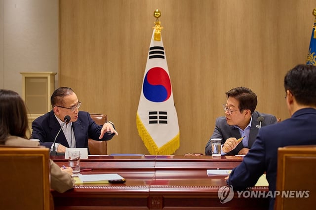 President Lee Jae Myung (R) speaks with National Security Adviser Wi Sung-lac during a National Security Council meeting at the presidential office in Seoul on July 10, 2025, in this photo provided by the office. (PHOTO NOT FOR SALE) (Yonhap)