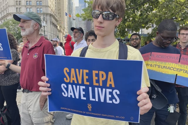 Protesters at Foley Square holding signs in support of EPA workers who were sidelined for criticizing the agency.