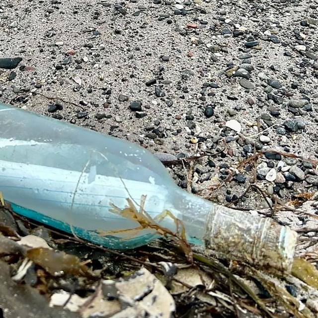 A bottle containing a note from a Newfoundland couple is shown on a beach in southwestern Ireland on July 7, 2025. 
THE CANADIAN PRESS/Handout - Kate Gay
 (Mandatory Credit)