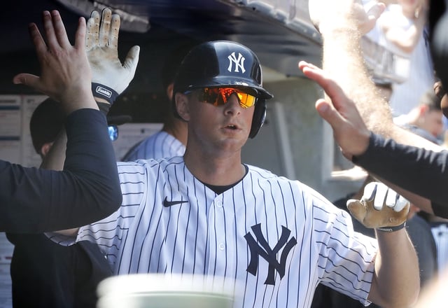 NEW YORK, NY - MAY 27: DJ LeMahieu #26 of the New York Yankees celebrates his seventh inning home run against the San Diego Padres in the dugout with his teammates at Yankee Stadium on May 27, 2023 in Bronx, New York.