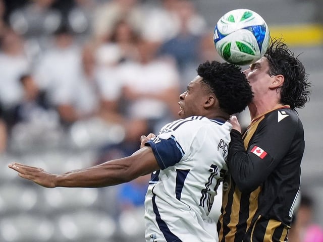 Vancouver Whitecaps' Ralph Priso, front left, and Valour FC's Kian Williams vie for the ball during first half Canadian Championship quarterfinal soccer action, in Vancouver, on Wednesday, July 9, 2024.