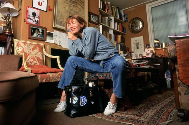 Jane Birkin with her original namesake bag. Sotheby's sold the luxury icon on Thursday.