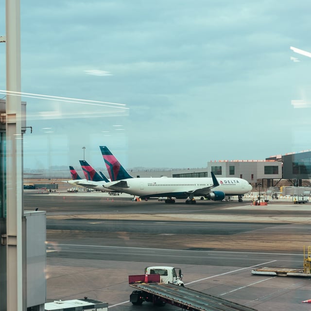 Delta Airplanes on the tarmac at JFK International Airport in New York on February 2025. Svetlana Dali, evaded layers of security to board a flight to France without a ticket or passport in November and on Thursday, May 22, she was convicted in Brooklyn federal court of being a stowaway. (Katherine and Mariel Tyler/The New York Times)