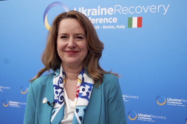 Amy Pope, Director General of the International Organization for Migration, is interviewed by the Associated Press during the Ukraine Recovery Conference at La Nuvola convention center in Rome, Thursday, July 10, 2025. (AP Photo/Paolo Santalucia)
