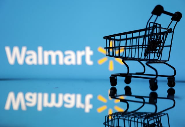 Shopping trolley is seen in front of Walmart logo in this illustration, July 24, 2022. REUTERS/Dado Ruvic/Illustration/File Photo