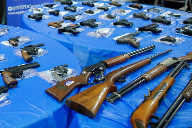 Guns are displayed after a gun buyback event organized by the New York City Police Department (NYPD), in the Queens borough of New York City, U.S., June 12, 2021. REUTERS/Eduardo Munoz/File Photo