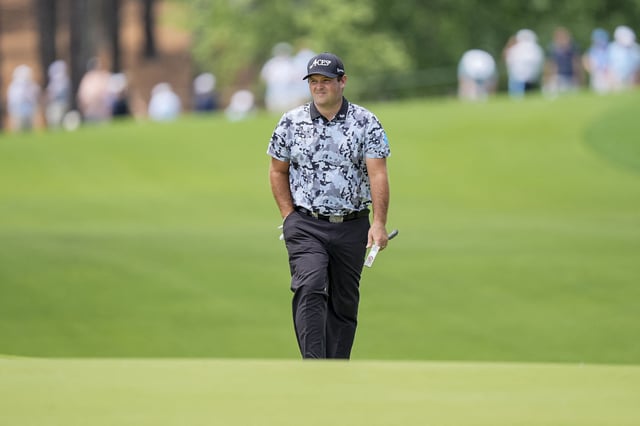 May 15, 2025; Charlotte, North Carolina, USA; Patrick Reed walks up to the fifth hole during the first round of the PGA Championship golf tournament at Quail Hollow. Mandatory Credit: Jim Dedmon-Imagn Images/File Photo