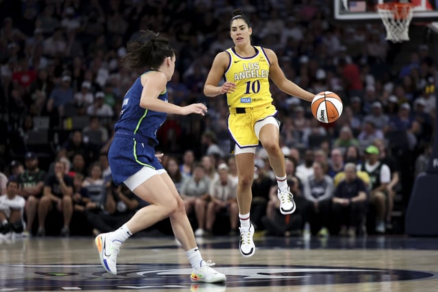 Courtney Williams #10 of the Minnesota Lynx dribbles up the court against Bridget Carleton #6 of the Minnesota Lynx in the third quarter at Target Center on June 21, 2025 in Minneapolis, Minnesota.