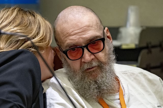 Jasmine North, federal public defender mitigation investigator, speaks with Ralph Leroy Menzies, during his competency hearing in Third District Court in West Jordan, Utah, on Monday, Nov 18, 2024.