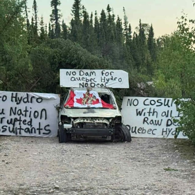 Signs are shown in this handout photo at the site of a tentatively planned hydroelectric development at Gull Island in Labrador on Wednesday, July 9, 2025. Quebec's hydro utility says it has suspended work at the site amid protests by some residents. THE CANADIAN PRESS/Handout - Innu Accountability Coalition (Mandatory Credit)