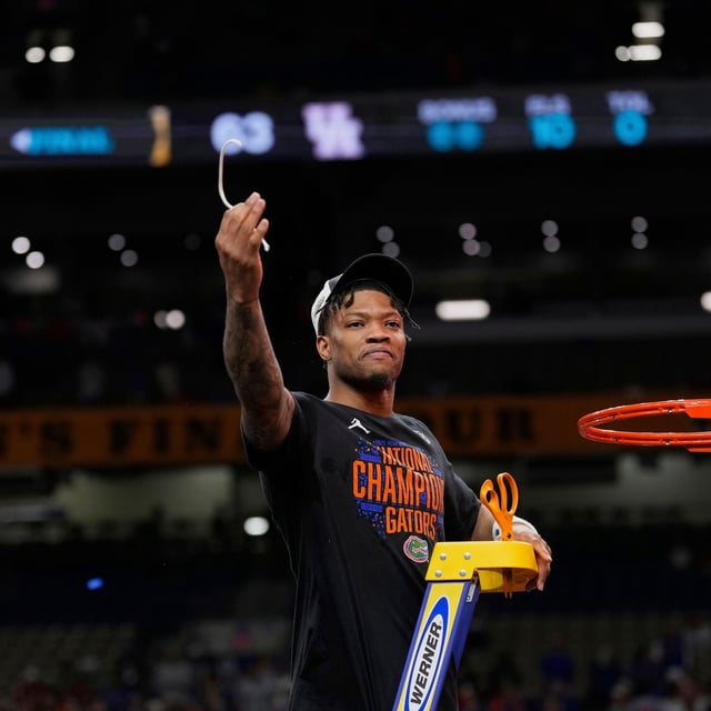 Florida's Alijah Martin cuts down the net after Florida beat Houston in the national championship at the Final Four of the NCAA college basketball tournament, Monday, April 7, 2025, in San Antonio. (AP Photo/Eric Gay)