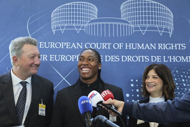 South Africa's Caster Semenya, center, answers reporters with lawyers Gregory Nott, left, and Shona Jolly KC after Semenya won a partial victory at the European Court of Human Rights on in her seven-year legal fight against track and field's sex eligibility rules, Thursday, July 10, 2025 in Strasbourg, eastern France. (AP Photo/Antonin Utz)
