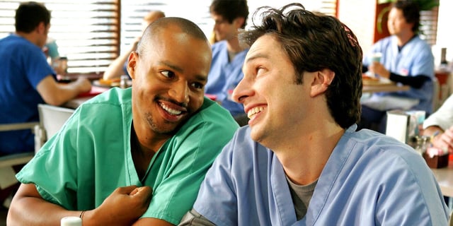 Donald Faison's Turk and Zach Braff's JD look into one anothers eyes lovingly in an image from 'Scrubs'