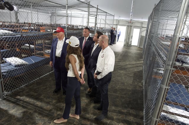 President Donald Trump speaks with reporters as he tours "Alligator Alcatraz," a new migrant detention facility at Dade-Collier Training and Transition facility, Tuesday, July 1, 2025, in Ochopee, Fla. (AP Photo/Evan Vucci)