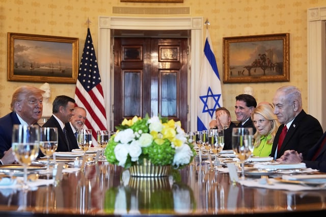 President Donald Trump, left, meets with Israel's Prime Minister Benjamin Netanyahu, right, as CIA Director John Ratcliffe, from second left, U.S. Ambassador to Israel Mike Huckabee, and from second right, Netanyahu's wife Sara Netanyahu, Israel's Strategic Affairs Minister Ron Dermer, Israel's National Security Council head Tzachi Hanegbi, obstructed, and Israel's Cabinet Secretary Yossi Fuchs listen in the Blue Room of the White House, Monday, July 7, 2025, in Washington. (AP Photo/Alex Brandon)